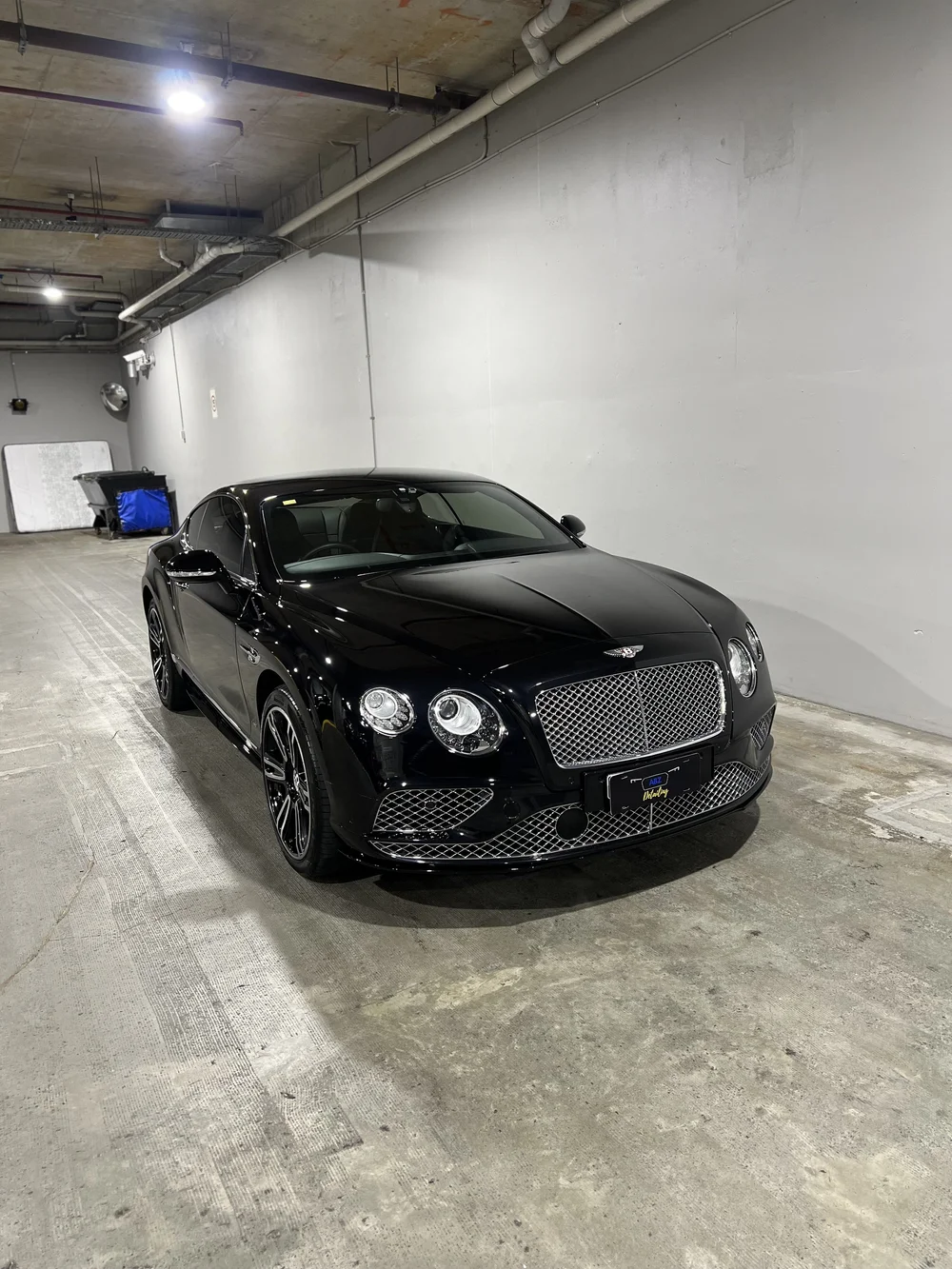 Black Bentley with a glossy protected finish